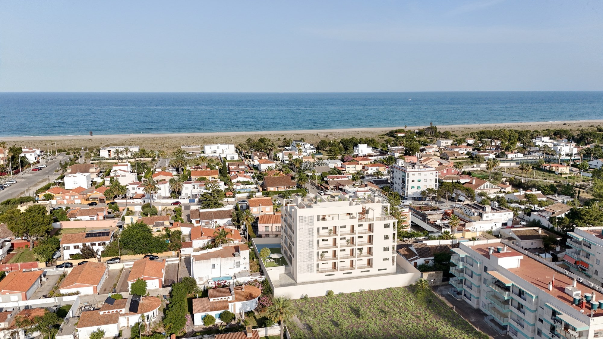 Vista aérea de una de nuestras promociones junto al mar